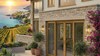 Porte-fenetre PVC 2 ouvrants sur mesure Aluplast - villa en pierre sur la Mediterranee
