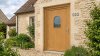 Porte d'entrée bois modèle 022 sur mesure — photo d'ambiance, chêne verni