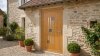 Porte d'entrée bois modèle 070 sur mesure — photo d'ambiance, chêne verni