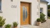 Porte d'entrée bois modèle 086 sur mesure — photo d'ambiance, chêne verni