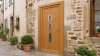 Porte d'entrée bois modèle 089 sur mesure — photo d'ambiance, chêne verni
