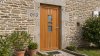 Porte d'entrée bois modèle 093 sur mesure — photo d'ambiance, chêne verni