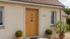 Porte d'entrée bois modèle 094 sur mesure — photo d'ambiance, chêne verni