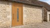Porte d'entrée bois modèle 115 sur mesure — photo d'ambiance, chêne verni