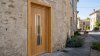 Porte d'entrée bois modèle 130 sur mesure — photo d'ambiance, chêne verni